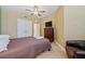 Comfortable bedroom featuring a bed, ceiling fan, closet, dresser, and cozy chair, a peaceful retreat at 960 Starkey Rd # 7503, Largo, FL 33771