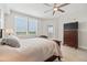 Bedroom featuring bright windows with plantation shutters, a ceiling fan, and wood-look floors at 960 Starkey Rd # 7503, Largo, FL 33771