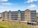 View of a condominium building featuring multiple floors, balconies, and parking at 960 Starkey Rd # 7503, Largo, FL 33771