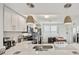 Well lit kitchen with quartz countertops and eat in kitchen island at 960 Starkey Rd # 7503, Largo, FL 33771