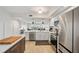 Open concept kitchen with stainless appliances and a breakfast bar at 960 Starkey Rd # 7503, Largo, FL 33771