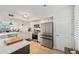 Bright kitchen features stainless appliances, white cabinetry, and an open design at 960 Starkey Rd # 7503, Largo, FL 33771