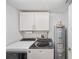 Functional laundry room with washer, dryer, storage cabinets, and water heater for convenient chores at 960 Starkey Rd # 7503, Largo, FL 33771