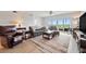 Bright and airy living room with comfortable seating, neutral decor, and sliding doors to the balcony at 960 Starkey Rd # 7503, Largo, FL 33771