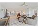 Open-concept living room featuring stylish furnishings, ceiling fan, and seamless flow into the dining area at 960 Starkey Rd # 7503, Largo, FL 33771