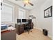 This home office boasts a large desk, stylish decor, and ample natural light at 960 Starkey Rd # 7503, Largo, FL 33771