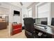 This home office boasts dual monitors, stylish decor, and ample natural light at 960 Starkey Rd # 7503, Largo, FL 33771