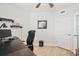 Bright office featuring desk, shelves, ceiling fan, and door to another room, creating a productive work environment at 960 Starkey Rd # 7503, Largo, FL 33771