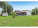 Expansive backyard featuring shed, well-manicured lawn, pool and screened in patio at 10113 Bell Creek Dr, Riverview, FL 33569