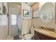 Well-lit bathroom features a vanity, toilet, and walk-in shower, with natural light coming through a window at 10113 Bell Creek Dr, Riverview, FL 33569