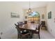 Formal dining room with chandelier, large window, and comfortable seating at 10113 Bell Creek Dr, Riverview, FL 33569