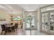 Bright foyer with elegant lighting, tile flooring, and decorative glass doors leading to an office at 10113 Bell Creek Dr, Riverview, FL 33569