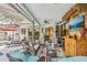 Stylish outdoor lanai with comfortable seating, tropical decor, and access to the pool area at 10113 Bell Creek Dr, Riverview, FL 33569