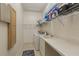 Functional laundry room featuring a washing machine, dryer, and shelving for ample storage at 10113 Bell Creek Dr, Riverview, FL 33569