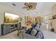 Open-concept living room showcases a cozy sitting area and seamless flow to the kitchen at 10113 Bell Creek Dr, Riverview, FL 33569