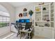 A cozy office space with bright natural lighting and built in shelving at 10113 Bell Creek Dr, Riverview, FL 33569