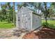 View of the rear of shed with gray walls and white trim accents at 10113 Bell Creek Dr, Riverview, FL 33569