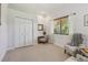 Bright sitting room offers a desk, a large window, and comfortable seating for relaxation or reading in natural light at 10113 Bell Creek Dr, Riverview, FL 33569