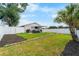 Expansive backyard complete with privacy fence and a cozy covered patio, great for entertainment and relaxation at 10202 Bellhurst Ct, Tampa, FL 33615