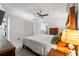 Cozy bedroom with hardwood furniture, neutral tones, closet space, and ceiling fan at 10202 Bellhurst Ct, Tampa, FL 33615