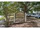 Community sign for Timberlane Park with lush greenery and a welcoming entrance at 10202 Bellhurst Ct, Tampa, FL 33615