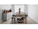 Contemporary dining area with a large table, bench seating, and decorative accents at 10202 Bellhurst Ct, Tampa, FL 33615