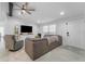 Spacious living room featuring comfortable seating and entertainment center at 10202 Bellhurst Ct, Tampa, FL 33615
