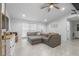 Comfortable living room with a large sectional sofa and plenty of natural light at 10202 Bellhurst Ct, Tampa, FL 33615