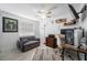 Bright home office with a comfortable sofa, desk, and stylish decor accents at 10202 Bellhurst Ct, Tampa, FL 33615