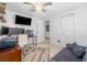 Functional home office with dual monitors, a ceiling fan, and ample storage at 10202 Bellhurst Ct, Tampa, FL 33615