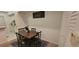 Cozy dining area with a table for four, next to the kitchen, and stylish decor at 10436 White Lake Ct # 10436, Tampa, FL 33626
