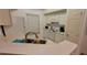 Functional kitchen with stainless steel sink, white cabinets, and standard appliances at 10436 White Lake Ct # 10436, Tampa, FL 33626