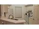 Bright kitchen with white cabinets and appliances, including a microwave and stove at 10436 White Lake Ct # 10436, Tampa, FL 33626