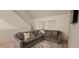 Comfortable living room featuring a large sectional sofa and patterned rug at 10436 White Lake Ct # 10436, Tampa, FL 33626