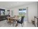 Bright dining area with a view and an adjacent living area, perfect for entertaining at 10580 Gliding Eagle Way, Land O Lakes, FL 34638