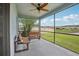 Enjoy the view from this screened-in lanai complete with ceiling fan and seating at 10580 Gliding Eagle Way, Land O Lakes, FL 34638