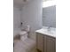 Clean bathroom featuring a shower-tub combo, stylish vanity, and tile flooring at 10605 Marsanne Pl, Riverview, FL 33578