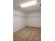A walk-in closet space featuring neutral carpet, wire rack shelving, and a ceiling light at 10605 Marsanne Pl, Riverview, FL 33578