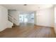 Bright and airy living room featuring modern flooring, fresh paint, and an open floor plan at 10605 Marsanne Pl, Riverview, FL 33578