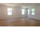 Open living room with recessed lighting and large windows allowing ample natural light at 10605 Marsanne Pl, Riverview, FL 33578
