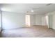 Large main bedroom features neutral carpet, white walls, and ceiling fan at 10605 Marsanne Pl, Riverview, FL 33578