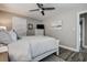 Comfortable bedroom with ceiling fan, white dresser, and a relaxing aesthetic at 1117 S Florida Ave, Tarpon Springs, FL 34689