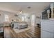 Spacious bedroom with wood tile floors and white furniture at 1117 S Florida Ave, Tarpon Springs, FL 34689