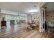 Open dining room featuring wood-look tile flooring and views of the outdoor pool area at 1117 S Florida Ave, Tarpon Springs, FL 34689