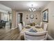 Inviting dining room features wood-look tile, chandelier, and decorative accents, offering a cozy atmosphere at 1117 S Florida Ave, Tarpon Springs, FL 34689