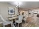 Cozy dining room featuring rustic wood table and access to the kitchen, ideal for Gathering meals at 1117 S Florida Ave, Tarpon Springs, FL 34689