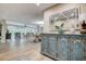 Open foyer with decorative cabinet and views into the living room and dining areas at 1117 S Florida Ave, Tarpon Springs, FL 34689