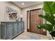 Stylish foyer with a decorative console table, mirror, and wood-look tile flooring at 1117 S Florida Ave, Tarpon Springs, FL 34689
