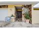 Charming front entrance featuring stone accents and a cozy sitting area to welcome guests at 1117 S Florida Ave, Tarpon Springs, FL 34689