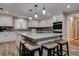 Island kitchen with granite countertops, stainless appliances, and pendant lighting at 1117 S Florida Ave, Tarpon Springs, FL 34689
